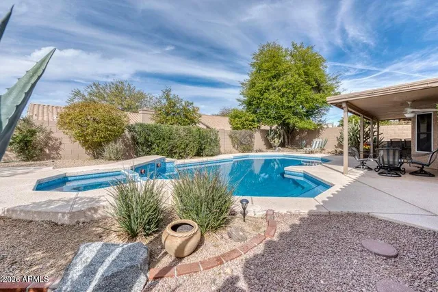 a view of swimming pool with a patio