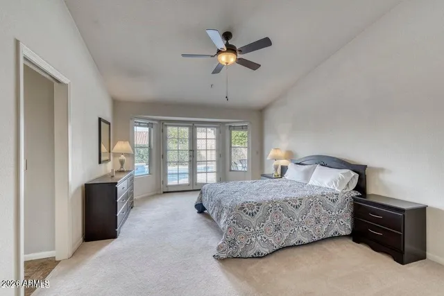 a bedroom with a bed dresser and a window