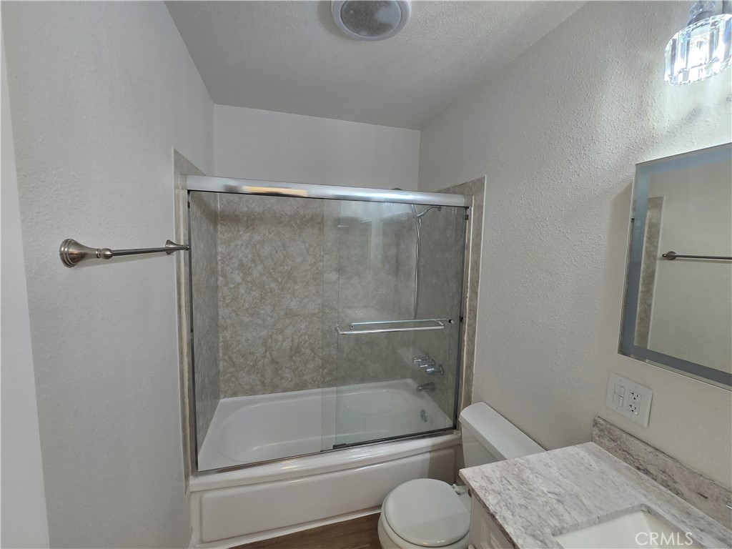 2718 Florida Street, Unit B Huntington Beach, CA 92648 - Photo 12 of 18 a bathroom with a shower and toilet