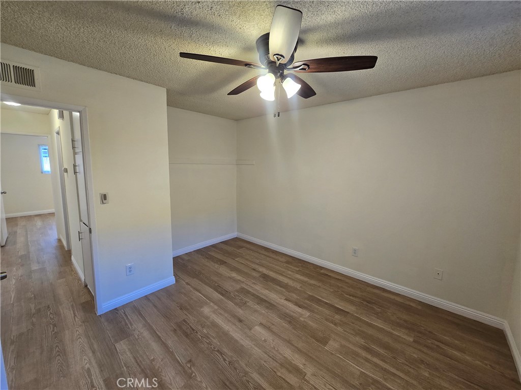 2718 Florida Street, Unit B Huntington Beach, CA 92648 - Photo 14 of 18 wooden floor in an empty room