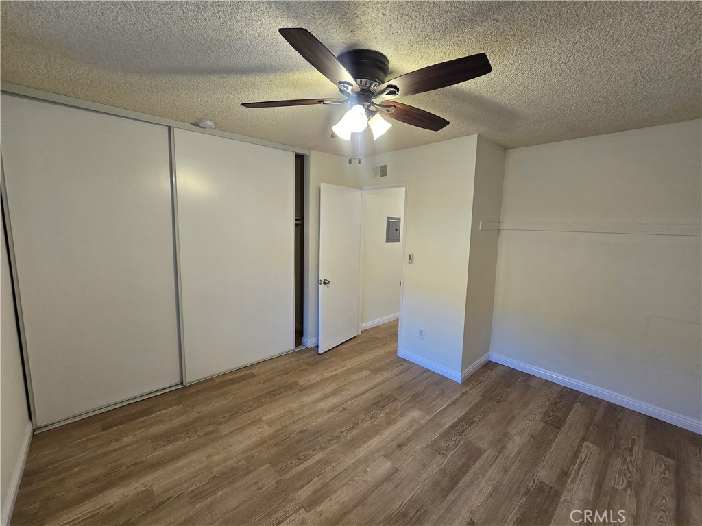 2718 Florida Street, Unit B Huntington Beach, CA 92648 - Photo 15 of 18 a view of an empty room with wooden floor