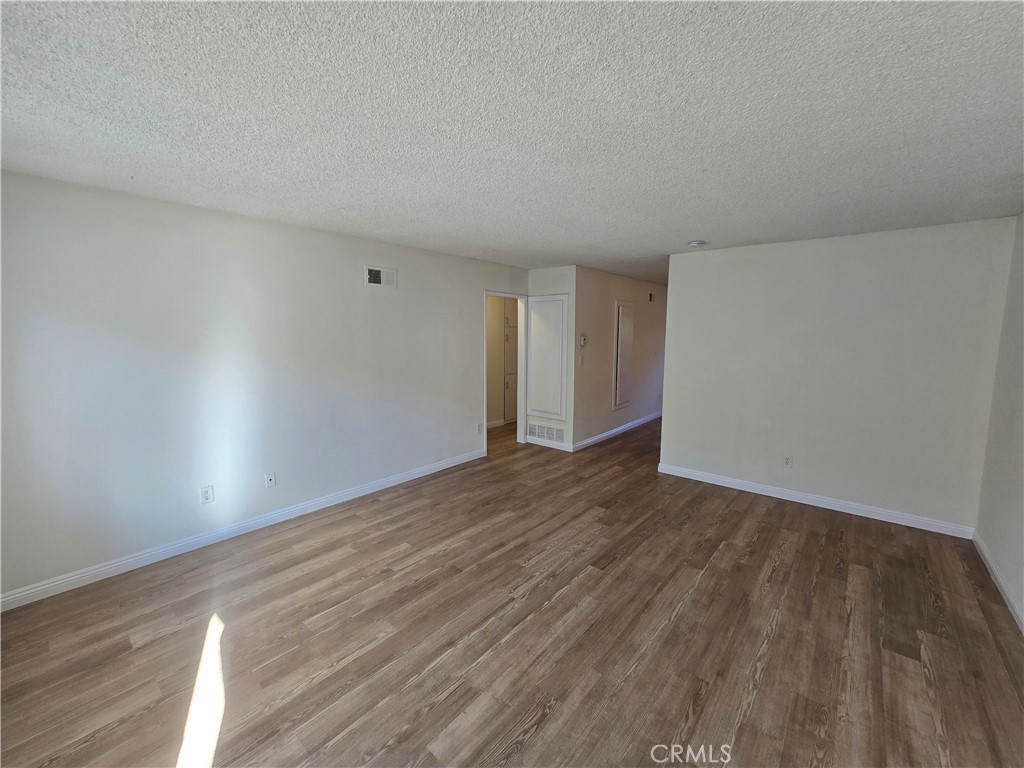 2718 Florida Street, Unit B Huntington Beach, CA 92648 - Photo 2 of 18 a view of an empty room and wooden floor