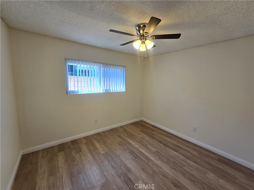 2718 Florida Street, Unit B Huntington Beach, CA 92648 - Photo 8 of 18 a view of empty room with window and wooden floor