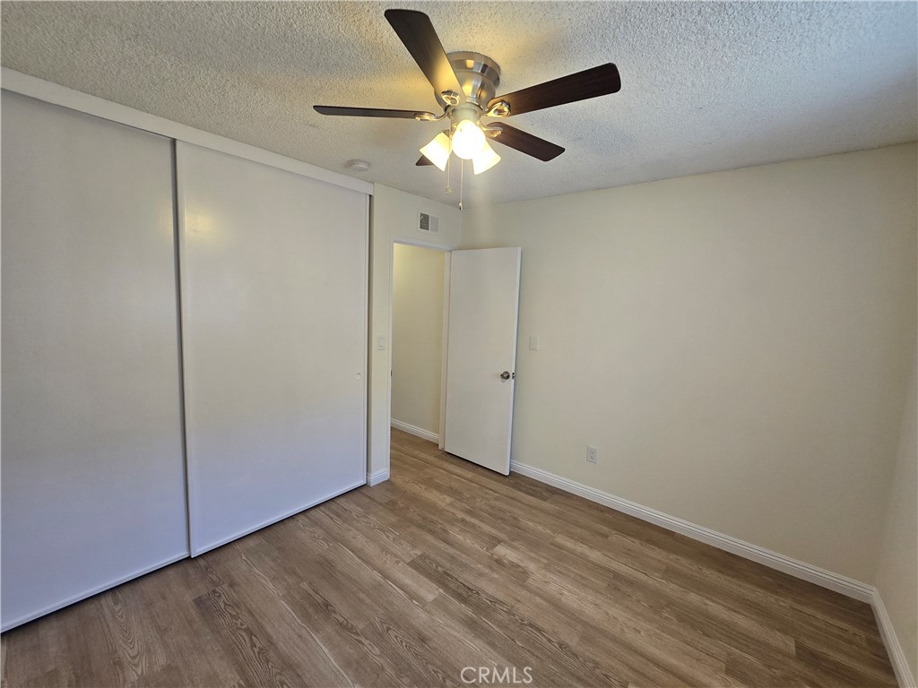 2718 Florida Street, Unit B Huntington Beach, CA 92648 - Photo 9 of 18 wooden floor in an empty room