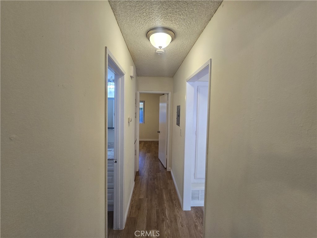 2718 Florida Street, Unit B Huntington Beach, CA 92648 - Photo 10 of 18 a view of a hallway with wooden floor