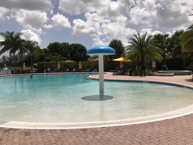 a swimming pool with view of lake
