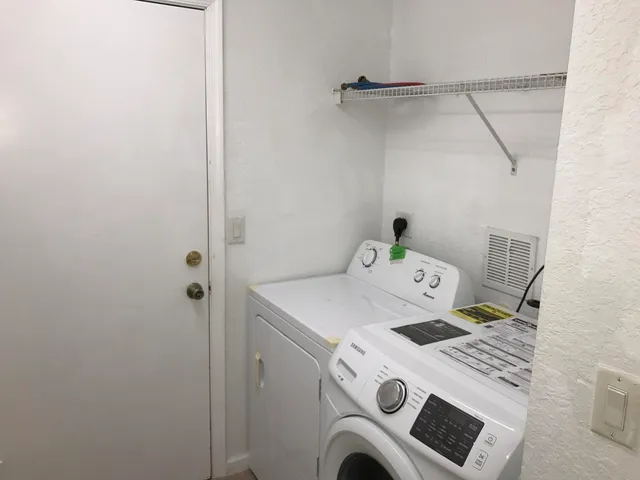 a utility room with dryer and washer