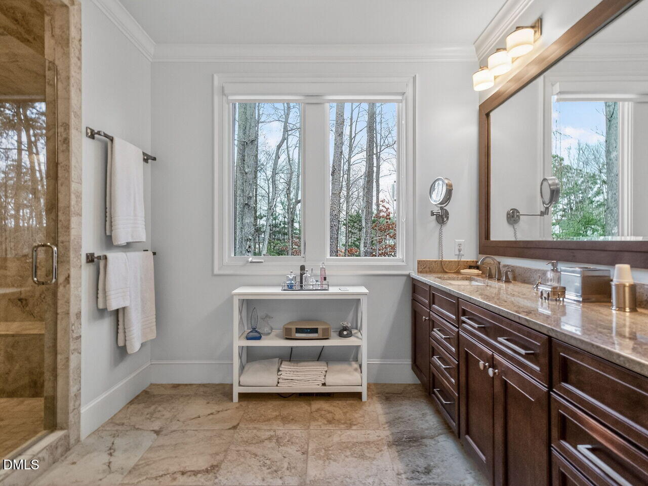 7516 Apex Barbecue Road Apex, NC 27502 - Photo 13 of 41 a spacious bathroom with sinks a tub and a mirror