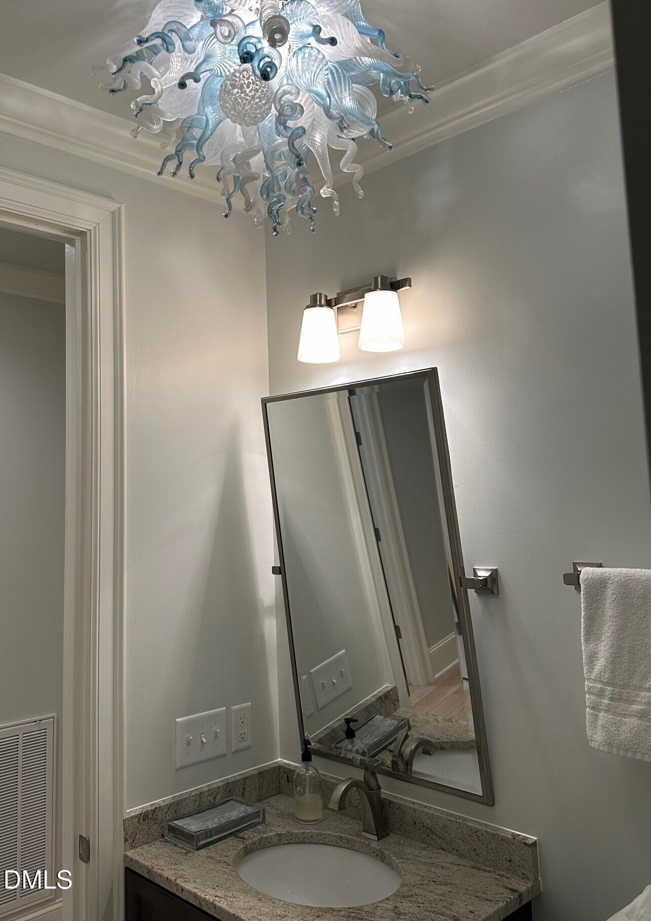 7516 Apex Barbecue Road Apex, NC 27502 - Photo 20 of 41 a bathroom with a sink a mirror and vanity