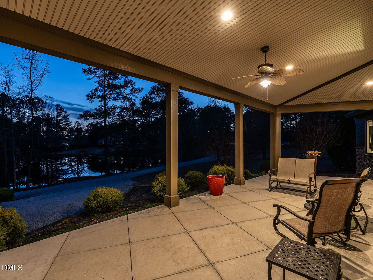 7516 Apex Barbecue Road Apex, NC 27502 - Photo 24 of 41 a view of a patio with table and chairs and potted plants