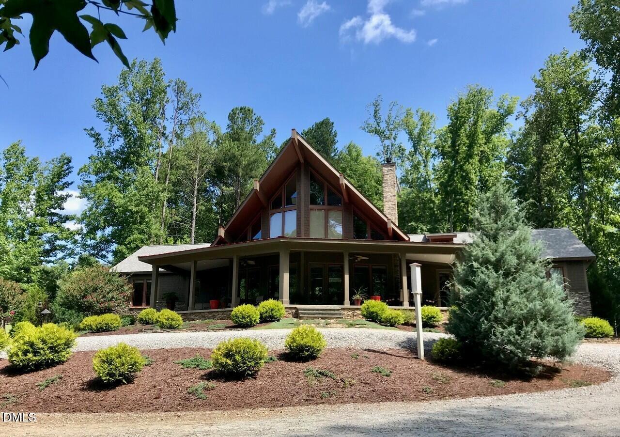 7516 Apex Barbecue Road Apex, NC 27502 - Photo 30 of 41 a front view of a house with a garden and porch