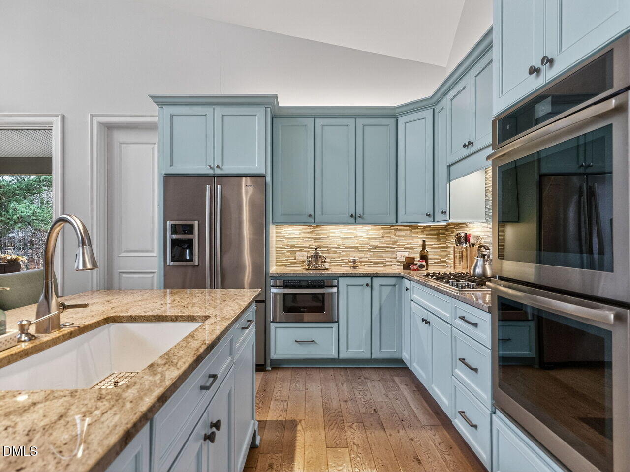 7516 Apex Barbecue Road Apex, NC 27502 - Photo 9 of 41 a kitchen with granite countertop a sink stainless steel appliances and cabinets