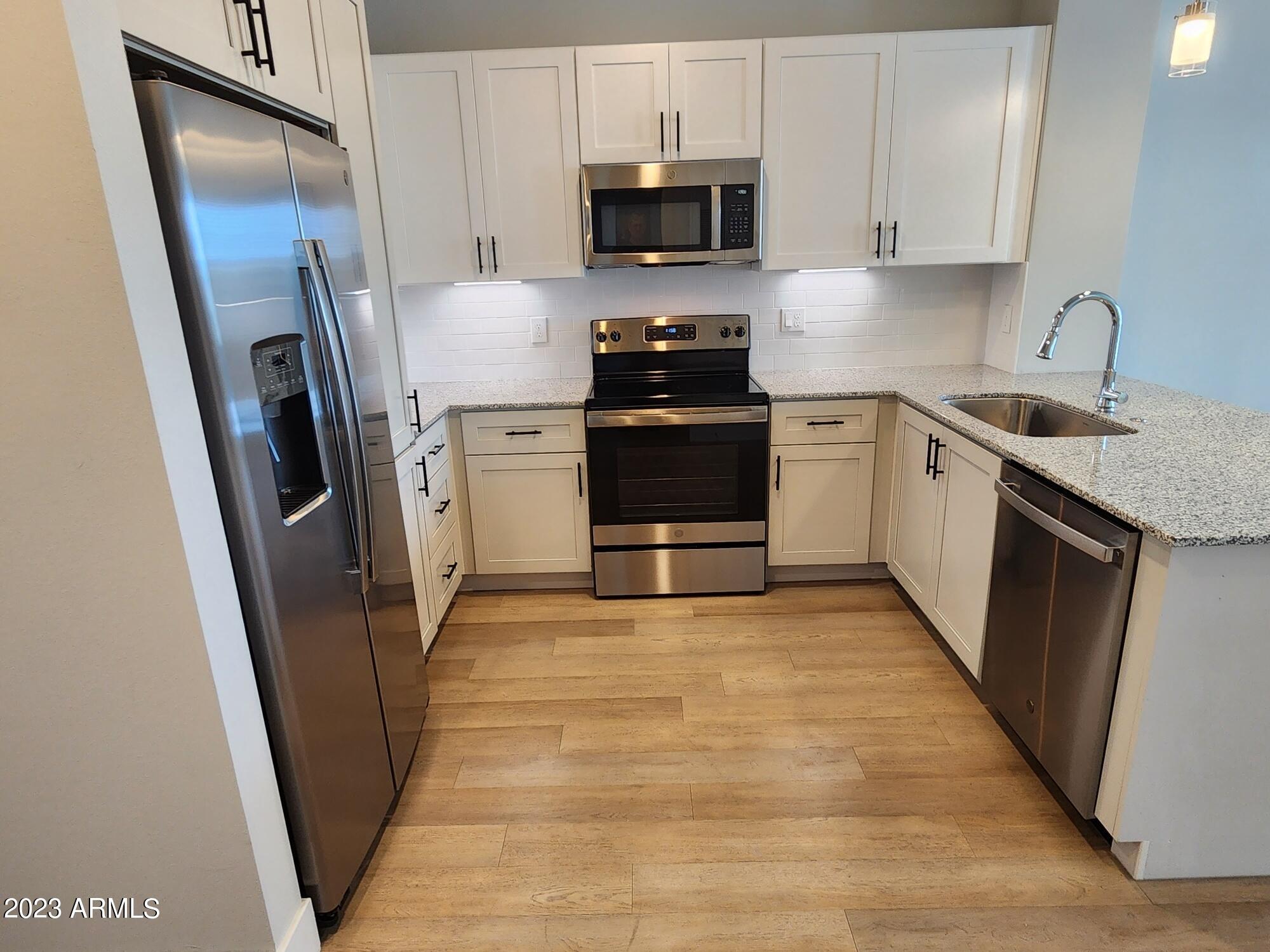 1375 North 145th Avenue, Unit A1 Goodyear, AZ 85395 - Photo 4 of 23 Kitchen 1