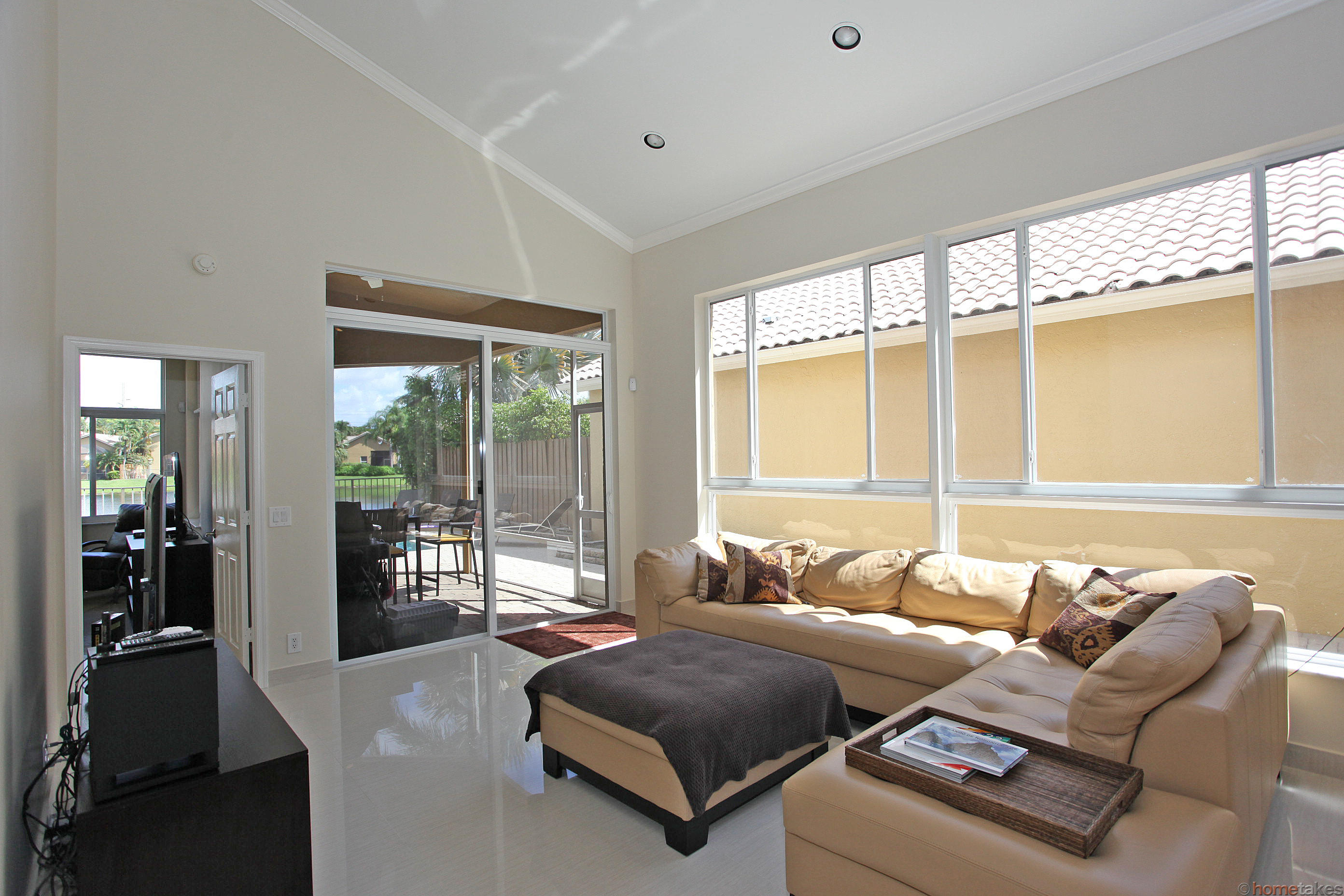 2469 Northwest 66th Drive Boca Raton, FL 33496 - Photo 2 of 15 a living room with furniture and a large window