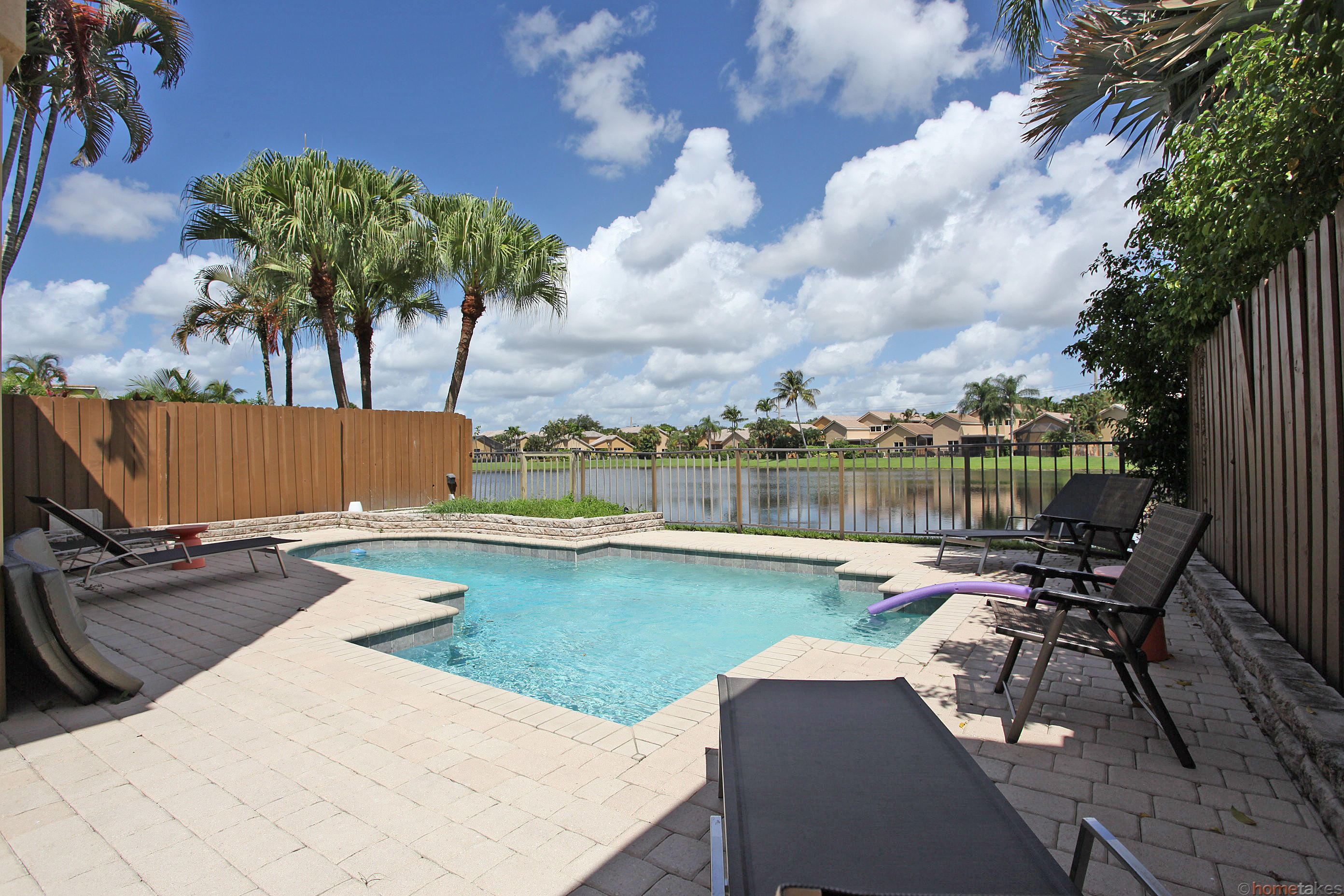 2469 Northwest 66th Drive Boca Raton, FL 33496 - Photo 11 of 15 a view of a swimming pool with lounge chair