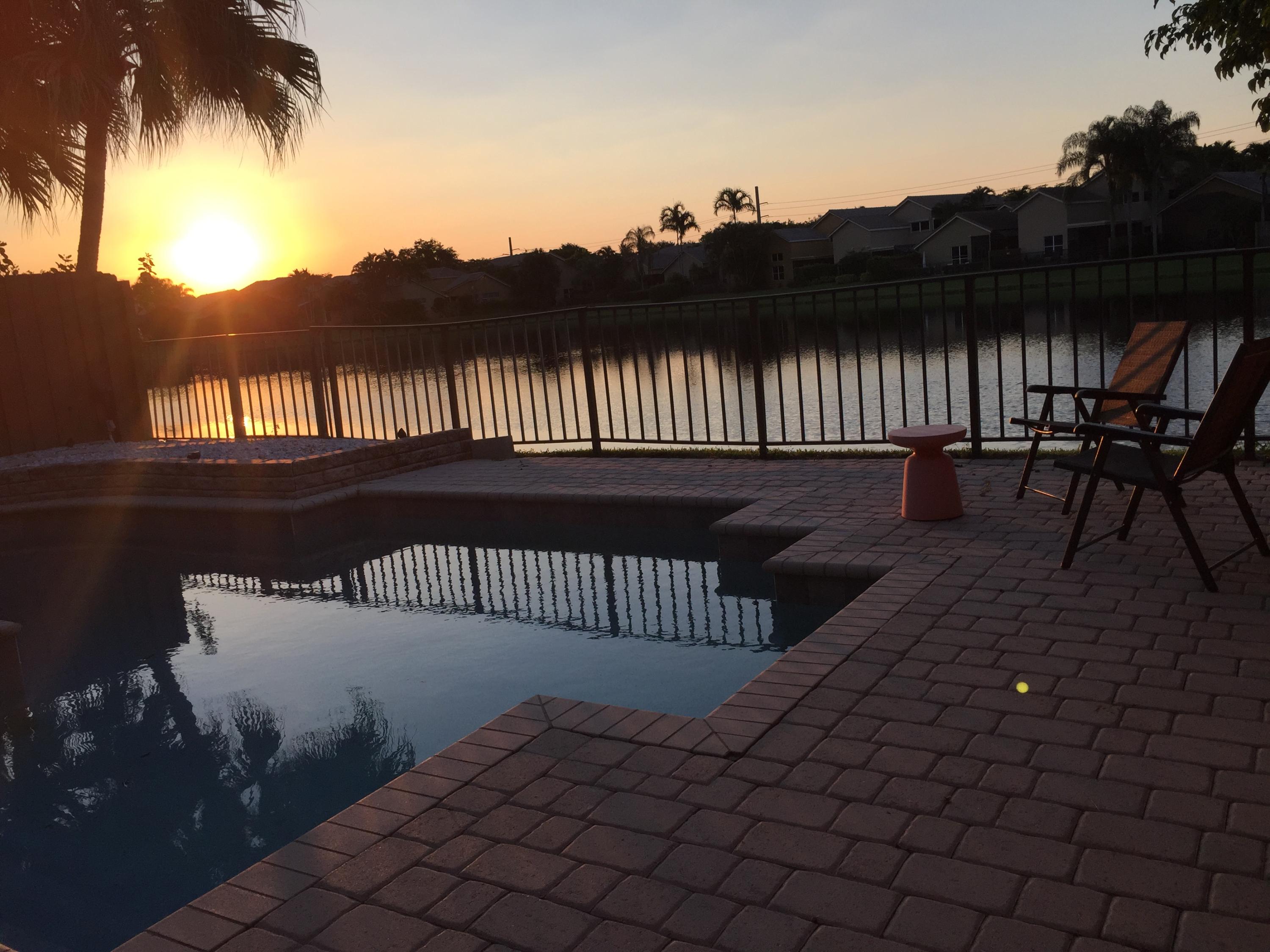 2469 Northwest 66th Drive Boca Raton, FL 33496 - Photo 15 of 15 a view of a roof deck with table and chairs