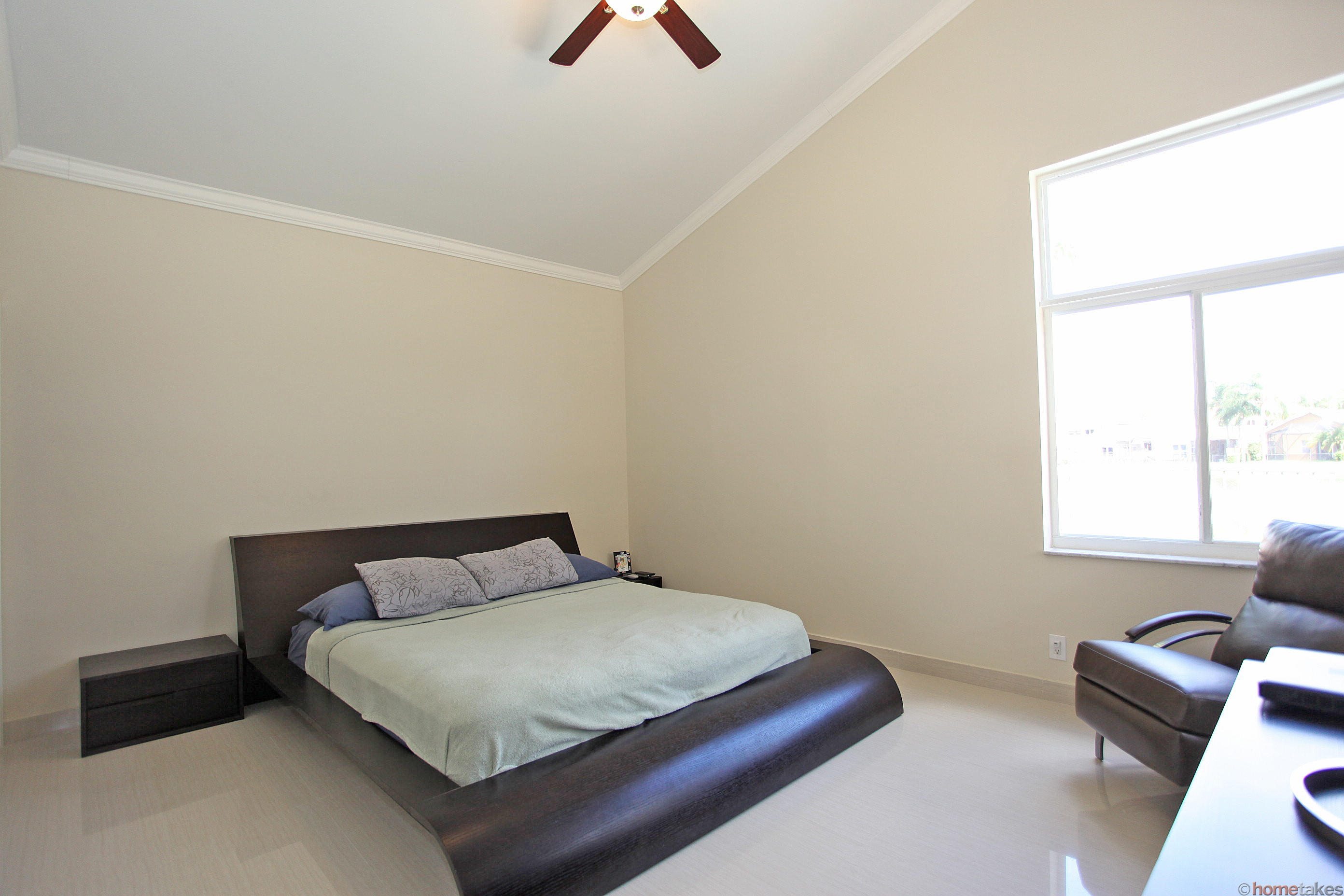 2469 Northwest 66th Drive Boca Raton, FL 33496 - Photo 6 of 15 a bedroom with a bed and window