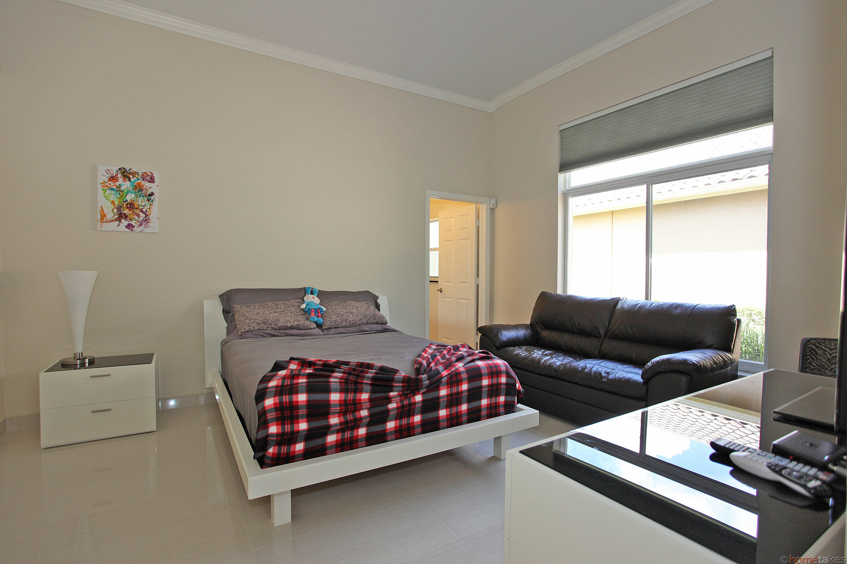 2469 Northwest 66th Drive Boca Raton, FL 33496 - Photo 8 of 15 a bedroom with a bed and window