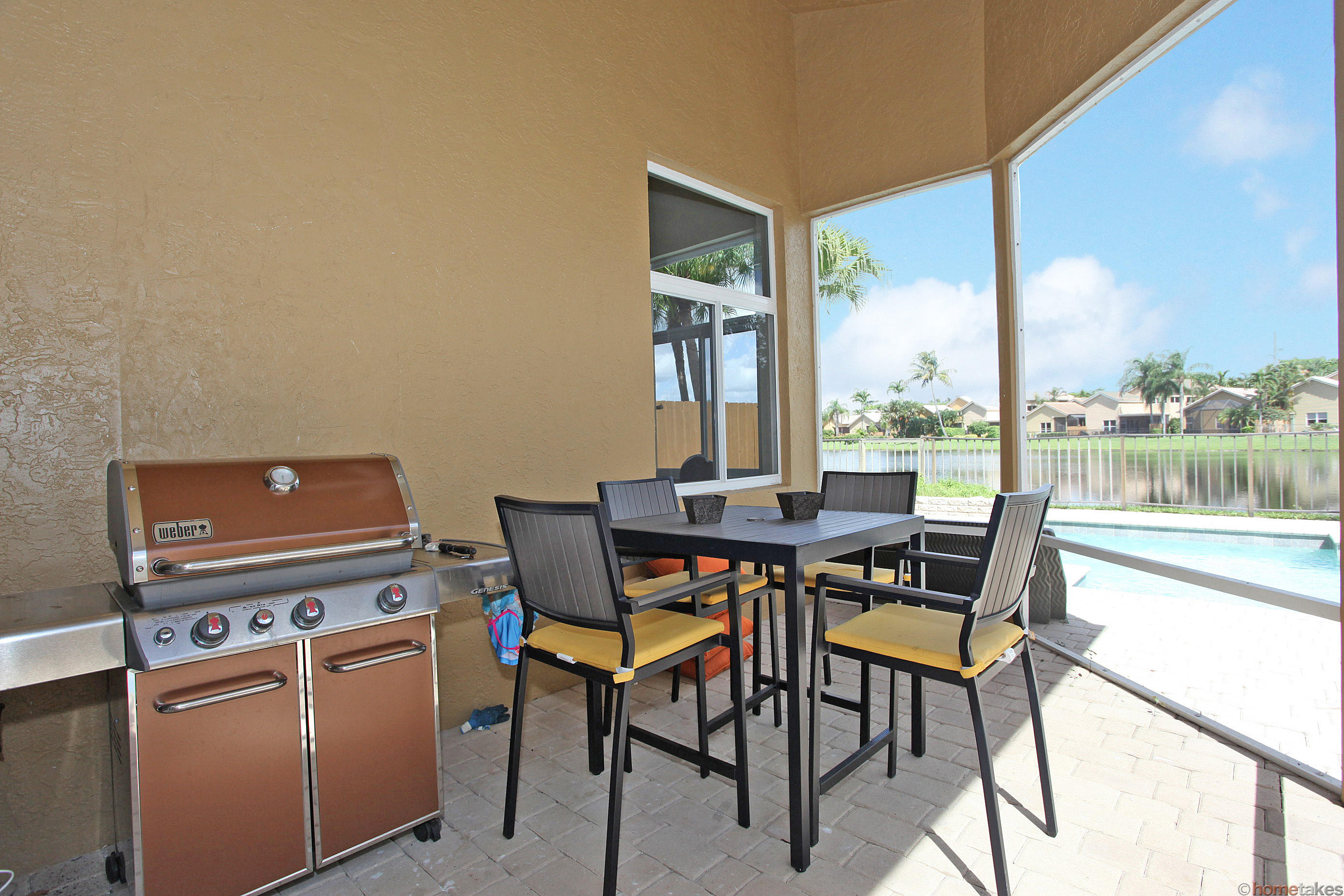 2469 Northwest 66th Drive Boca Raton, FL 33496 - Photo 10 of 15 a dining room with furniture and a floor to ceiling window