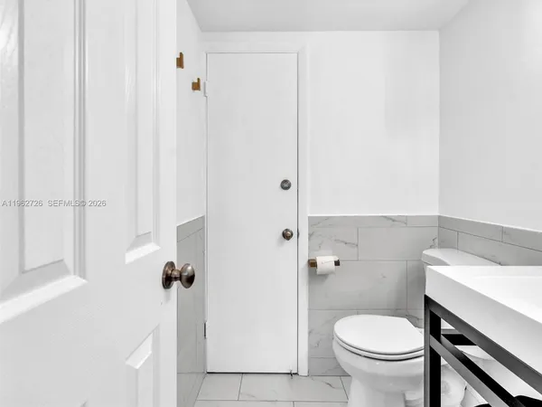 a bathroom with a sink and toilet