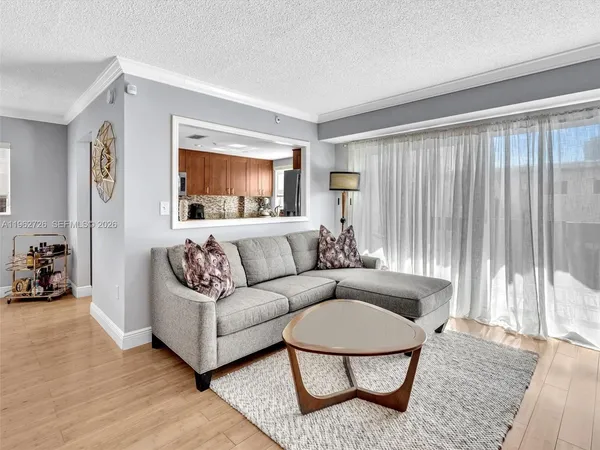 a living room with furniture and a window