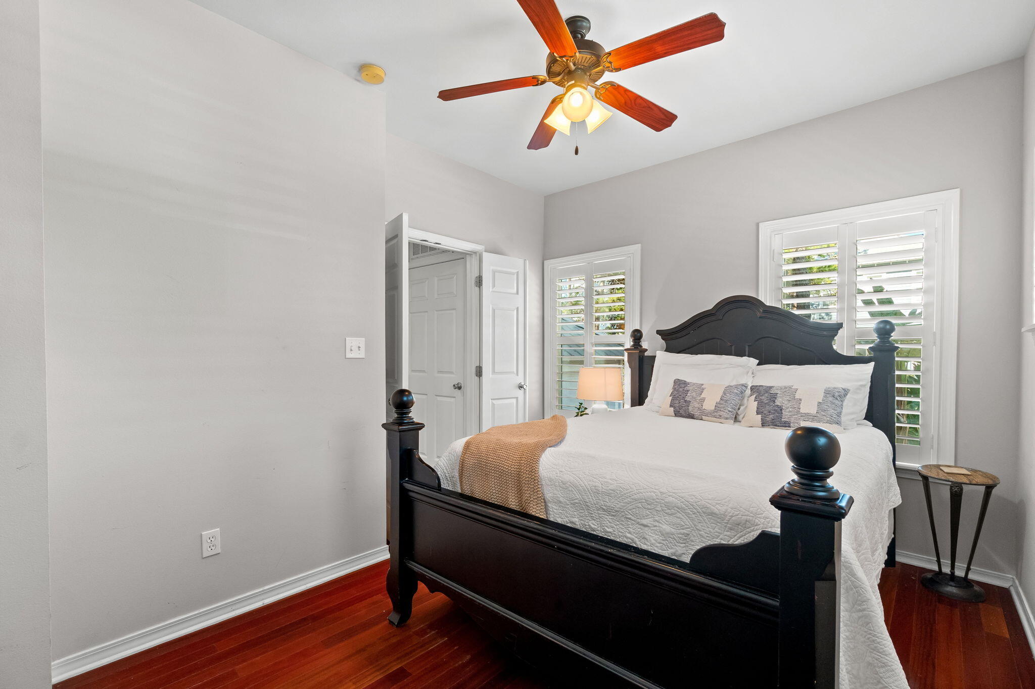 237 Hidden Lake Way Santa Rosa Beach, FL 32459 - Photo 12 of 41 a bedroom with a bed and wooden floor