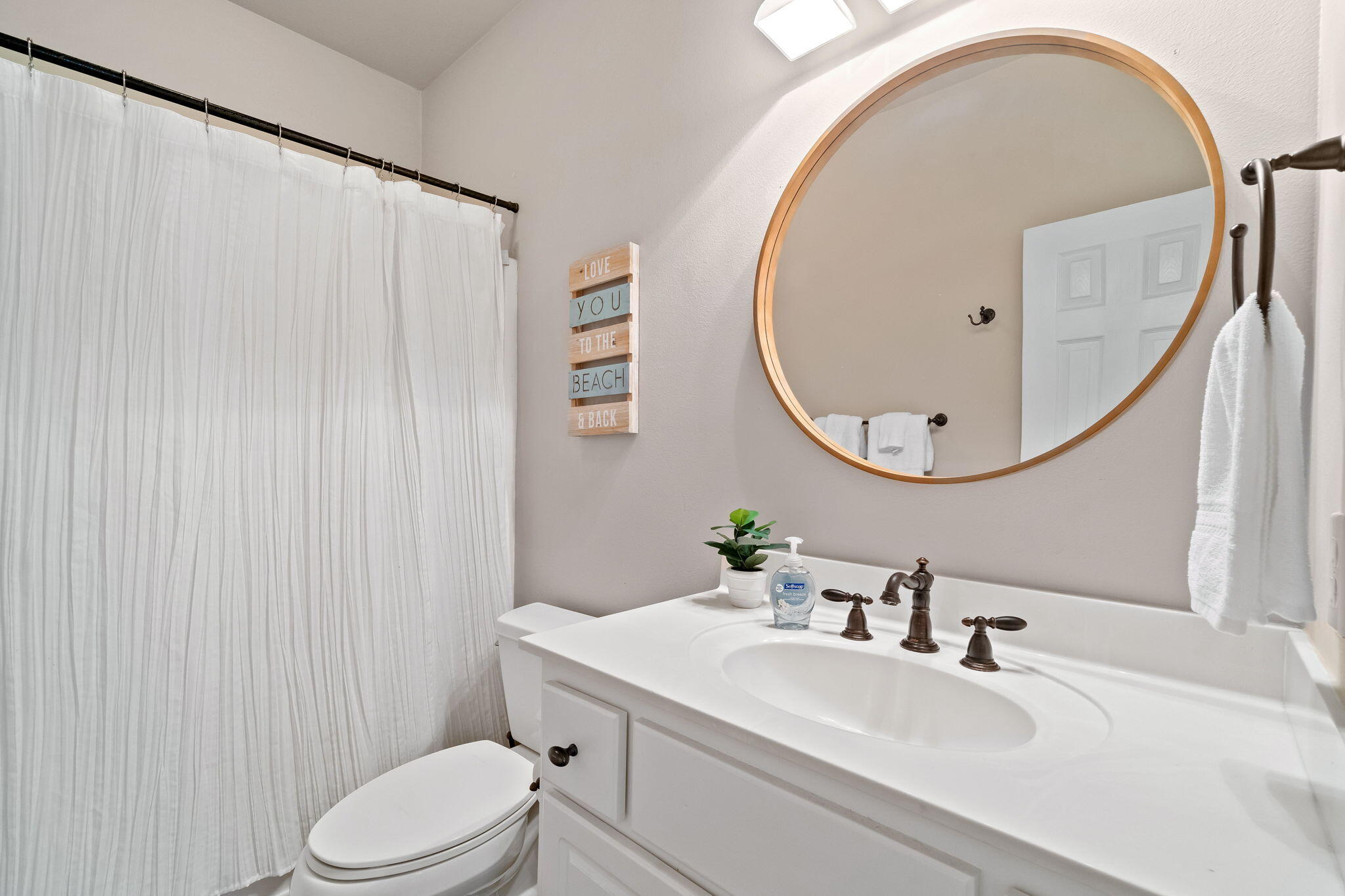 237 Hidden Lake Way Santa Rosa Beach, FL 32459 - Photo 13 of 41 a bathroom with a sink a toilet and a mirror