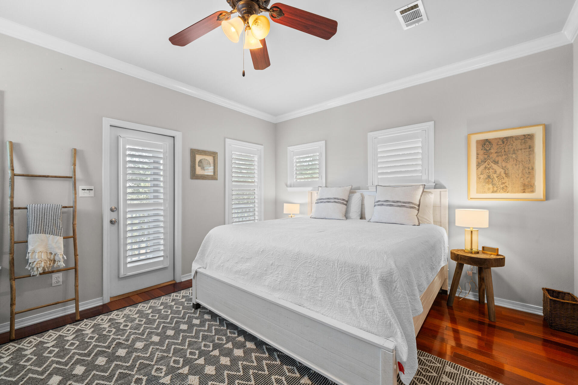 237 Hidden Lake Way Santa Rosa Beach, FL 32459 - Photo 16 of 41 a bedroom with a bed and wooden floor