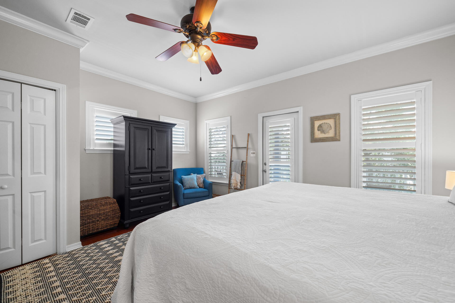 237 Hidden Lake Way Santa Rosa Beach, FL 32459 - Photo 17 of 41 a bedroom with a bed and a chandelier