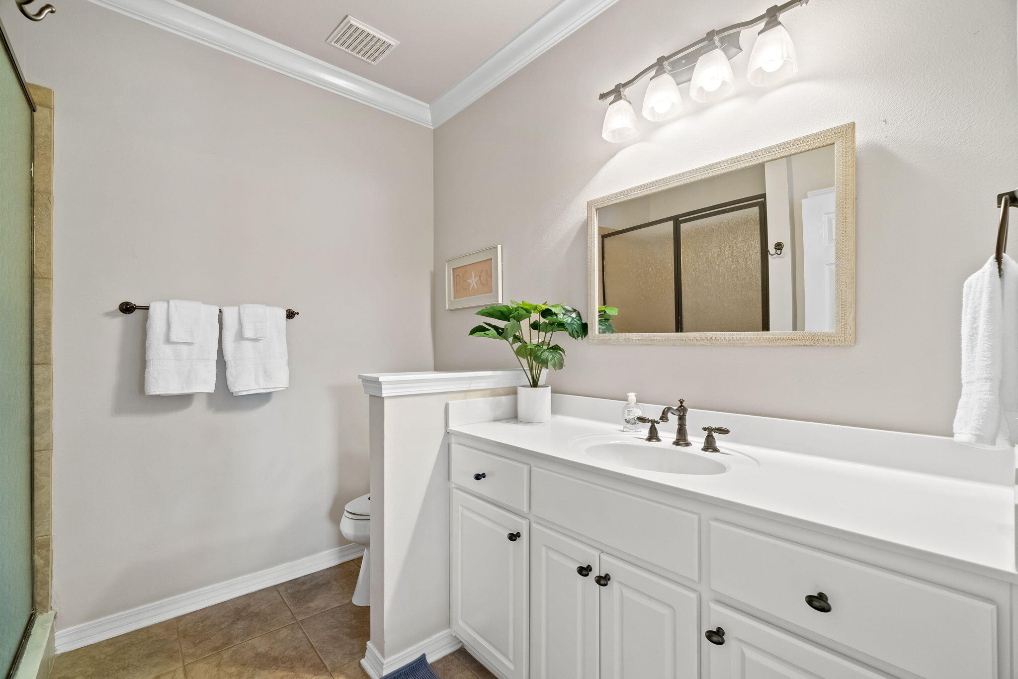237 Hidden Lake Way Santa Rosa Beach, FL 32459 - Photo 18 of 41 a bathroom with a sink vanity and mirror