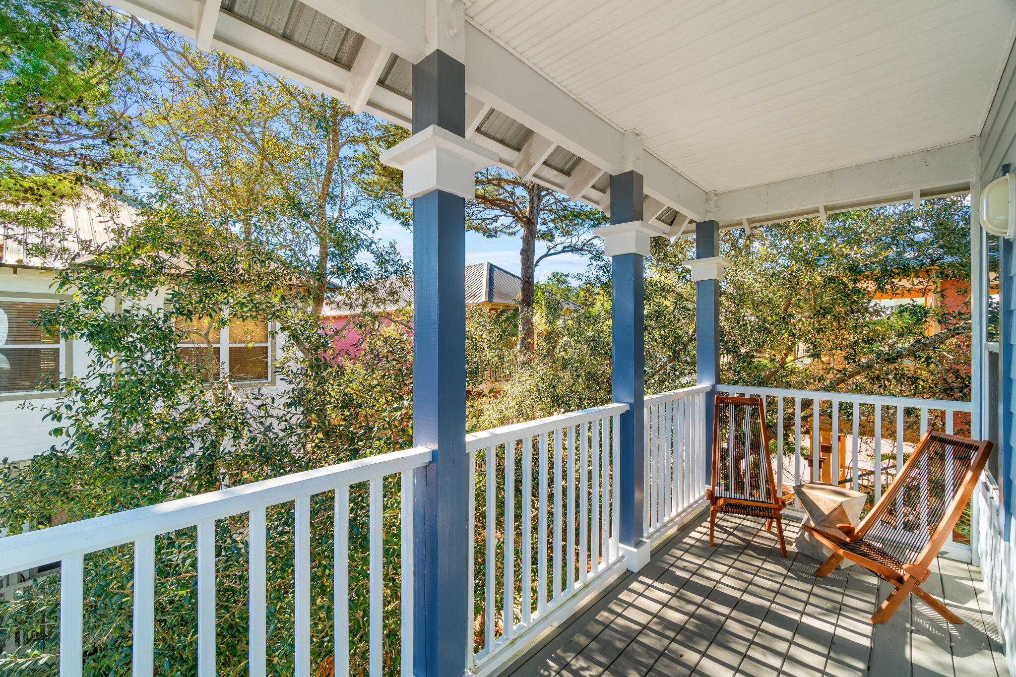 237 Hidden Lake Way Santa Rosa Beach, FL 32459 - Photo 20 of 41 a view of a chairs and table in the balcony