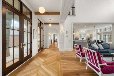 a large kitchen with kitchen island a large counter space a sink stainless steel appliances and cabinets