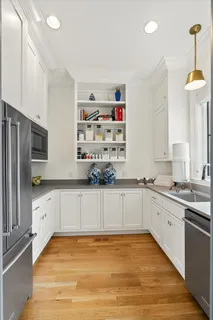 a living room with furniture fireplace and flat screen tv