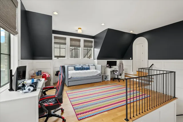 a view of a swimming pool with chairs and plants