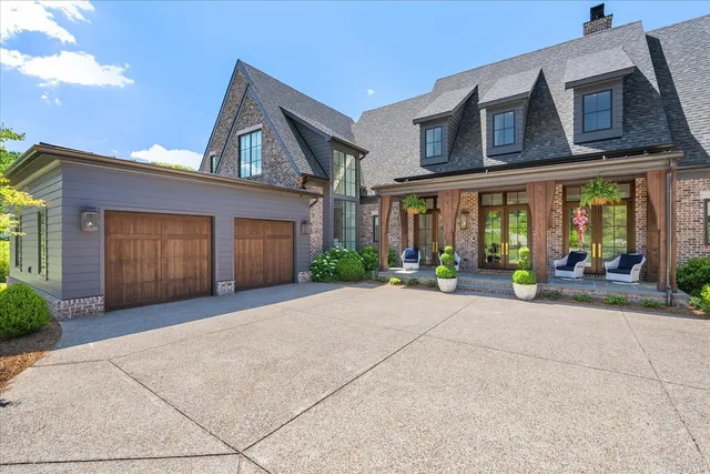 a view of a house with outdoor space and porch