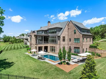 a view of a patio with chairs and table