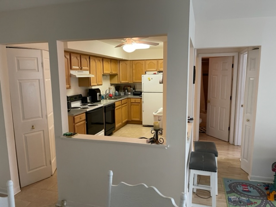 2226 South Goebbert Road, Unit 270 Arlington Heights, IL 60005 - Photo 6 of 19 a kitchen with a refrigerator and a stove top oven