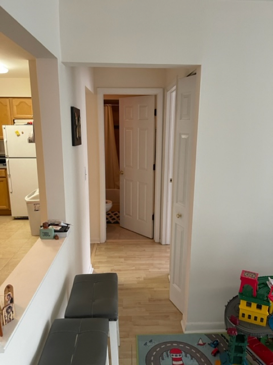 2226 South Goebbert Road, Unit 270 Arlington Heights, IL 60005 - Photo 9 of 19 a view of a room with wooden floor and furniture