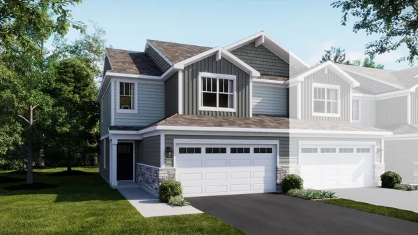 a front view of a house with a garden and plants