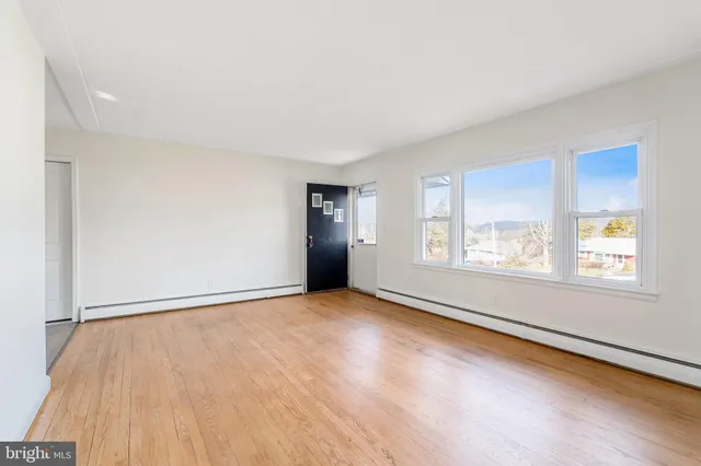 an empty room with windows