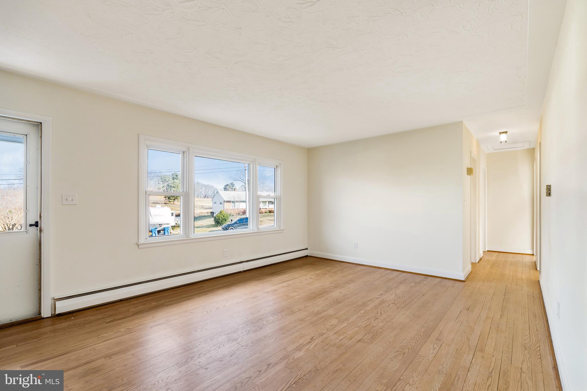 404 West Pearl Street Rising Sun, MD 21911 - Photo 18 of 23 an empty room with wooden floor and windows