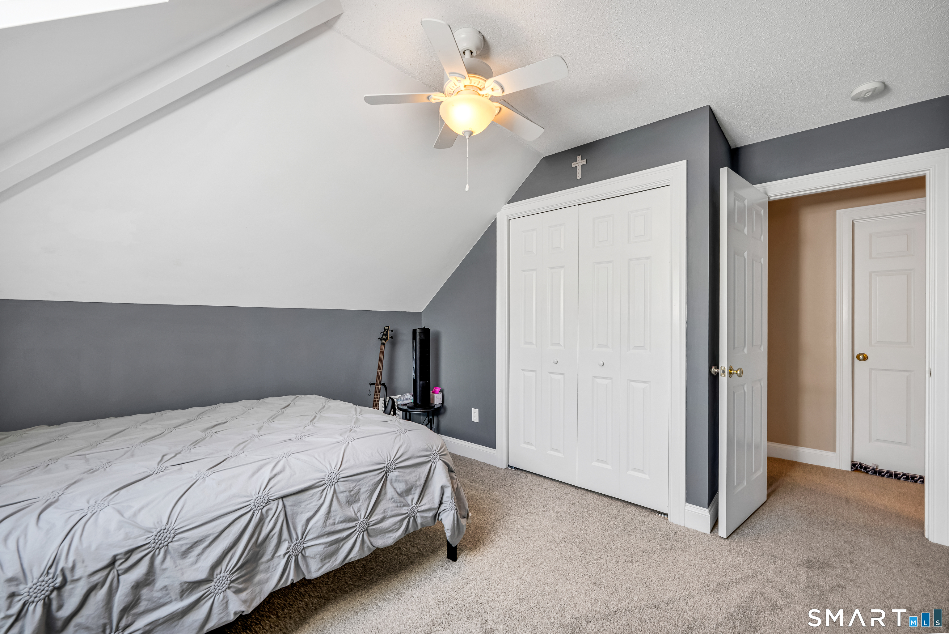 409 Beckley Road Berlin, CT 06037 - Photo 21 of 39 a bedroom with a bed and a chandelier