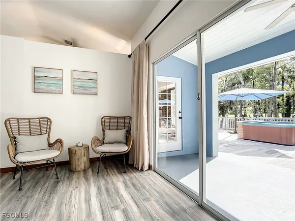 a bedroom with furniture and a window