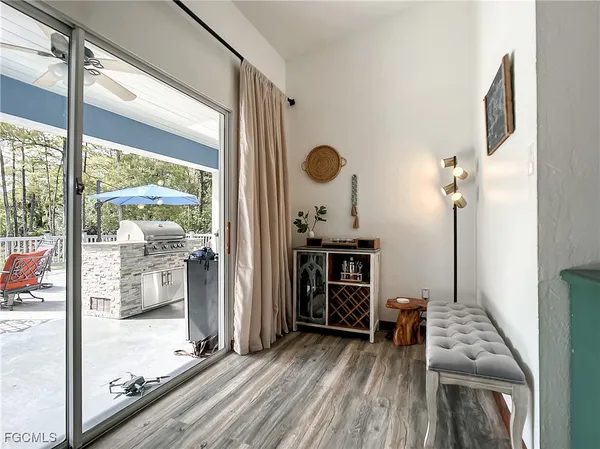 a view of a hardwood floor and windows in a room