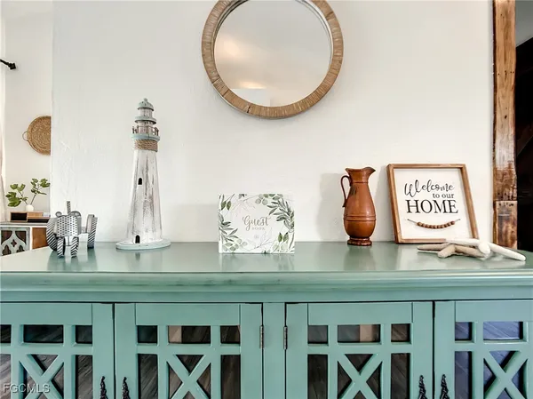 a table with chairs and a wooden floor