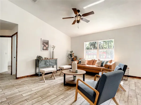 a living room with furniture and a window