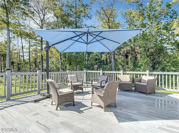 a view of roof deck with furniture