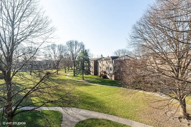 a view of a yard with basketball court