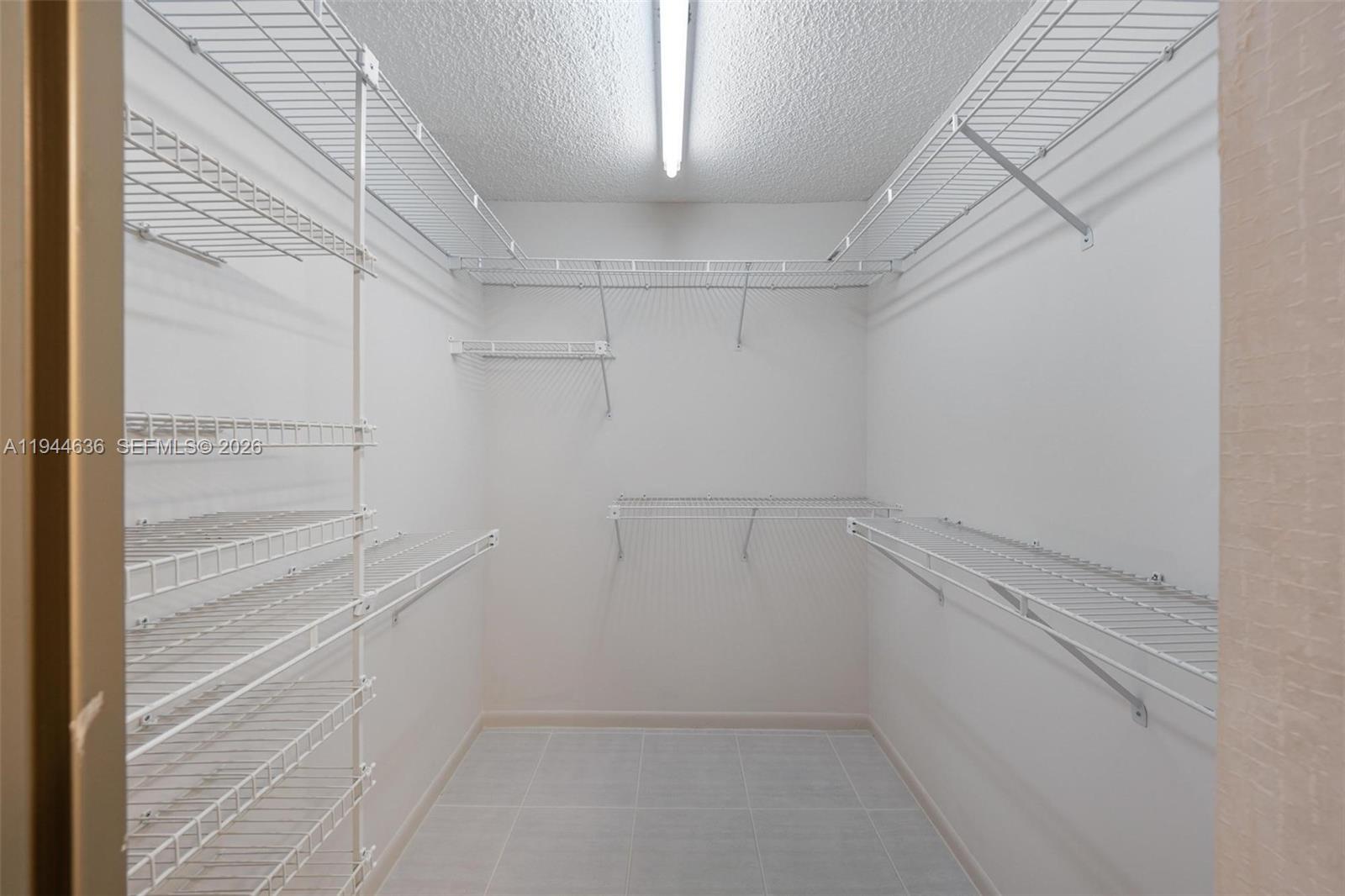 21877 Arriba Real Boca Raton, FL 33433 - Photo 14 of 40 a view of a room with racks on the wall