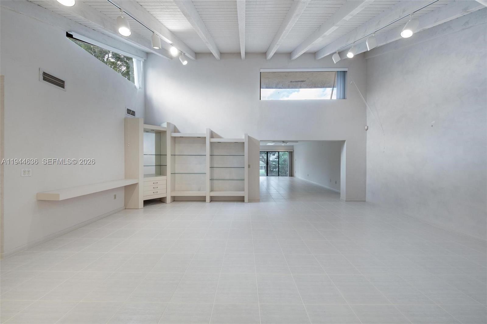 21877 Arriba Real Boca Raton, FL 33433 - Photo 17 of 40 an empty room with white walls and windows